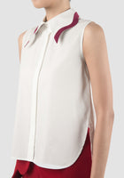 Phlox white sleeveless shirt with accented collar in plum